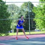 Above, Savannah Smith awaits to return the ball after her opponent serves. "I was very focused on getting the ball back over the net," Smith said.