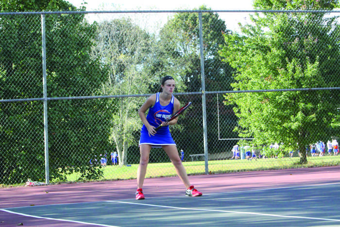 Above, Savannah Smith awaits to return the ball after her opponent serves. "I was very focused on getting the ball back over the net," Smith said.