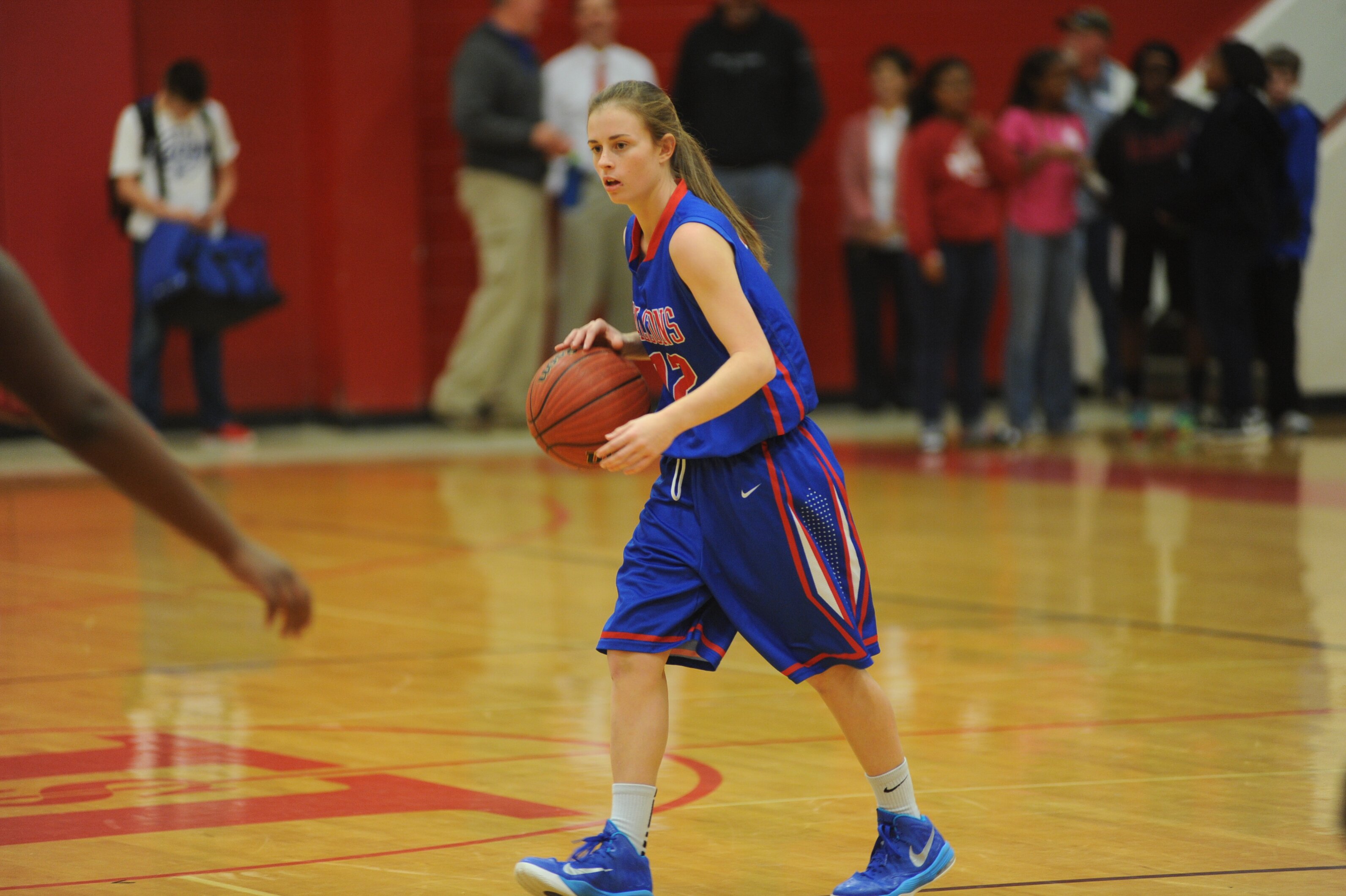 Junior Savannah Smith receives a pass at the game against Hendersonville. The Lady Falcons went on to win the game 58-45. Photo by Lifetouch.