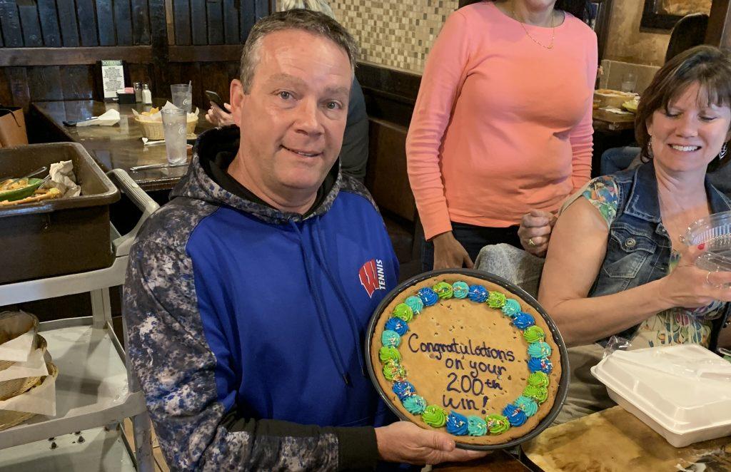 Tennis coach achieves 200th win