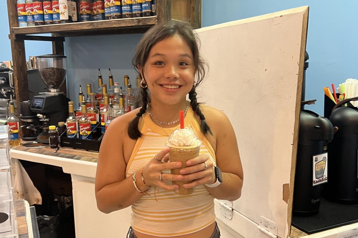 Una Fong finishes making her perfect iced caramel latte at Brew Ridge Deli.  Brew Ridge Deli is the perfect place for study dates and cute little meet-ups. “It was so good, I need to come back everyday," said Fong. (Photo by Savanna Hinchey)